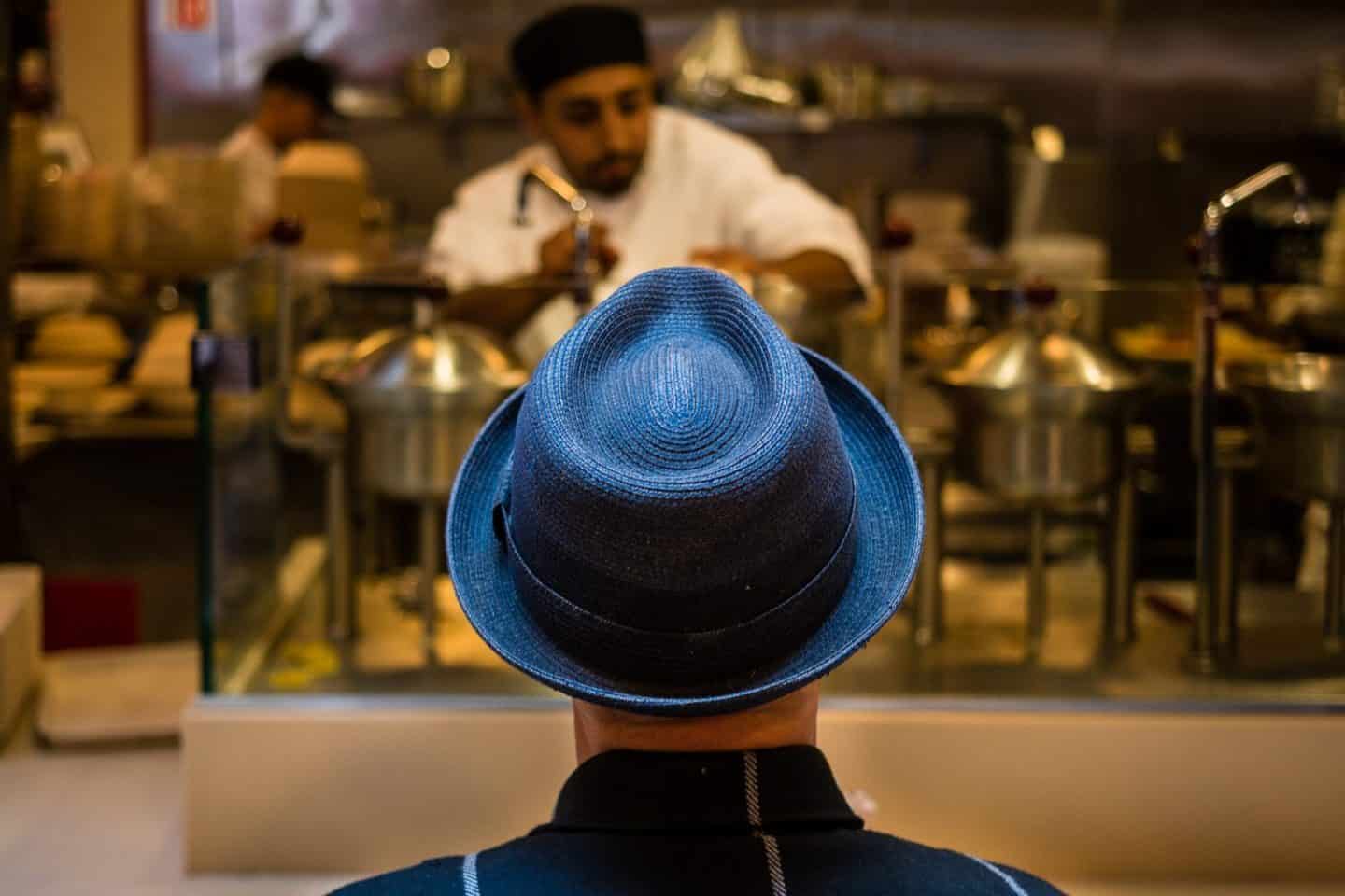 Man in Blue Hat by Ibarionex Perello
