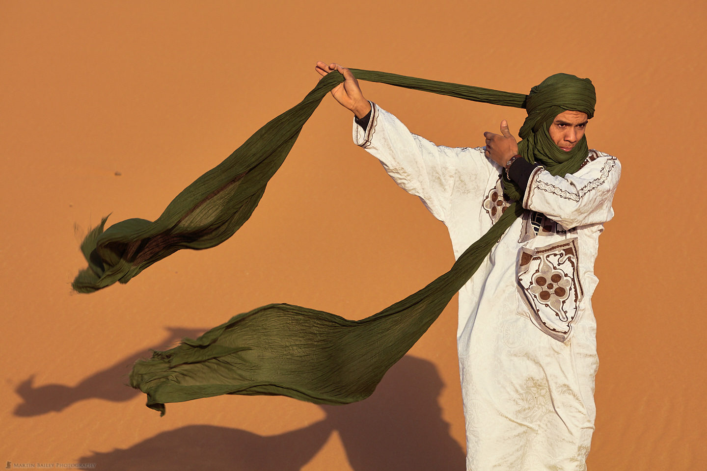 Young Moroccan Man Tying Turban