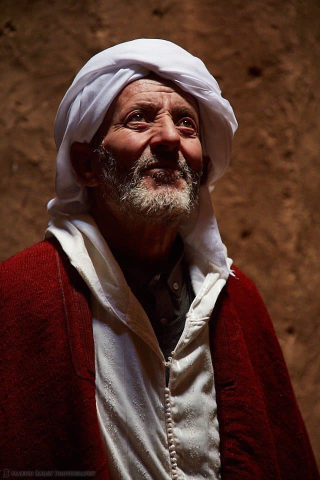Moroccan Man in Adobe Building